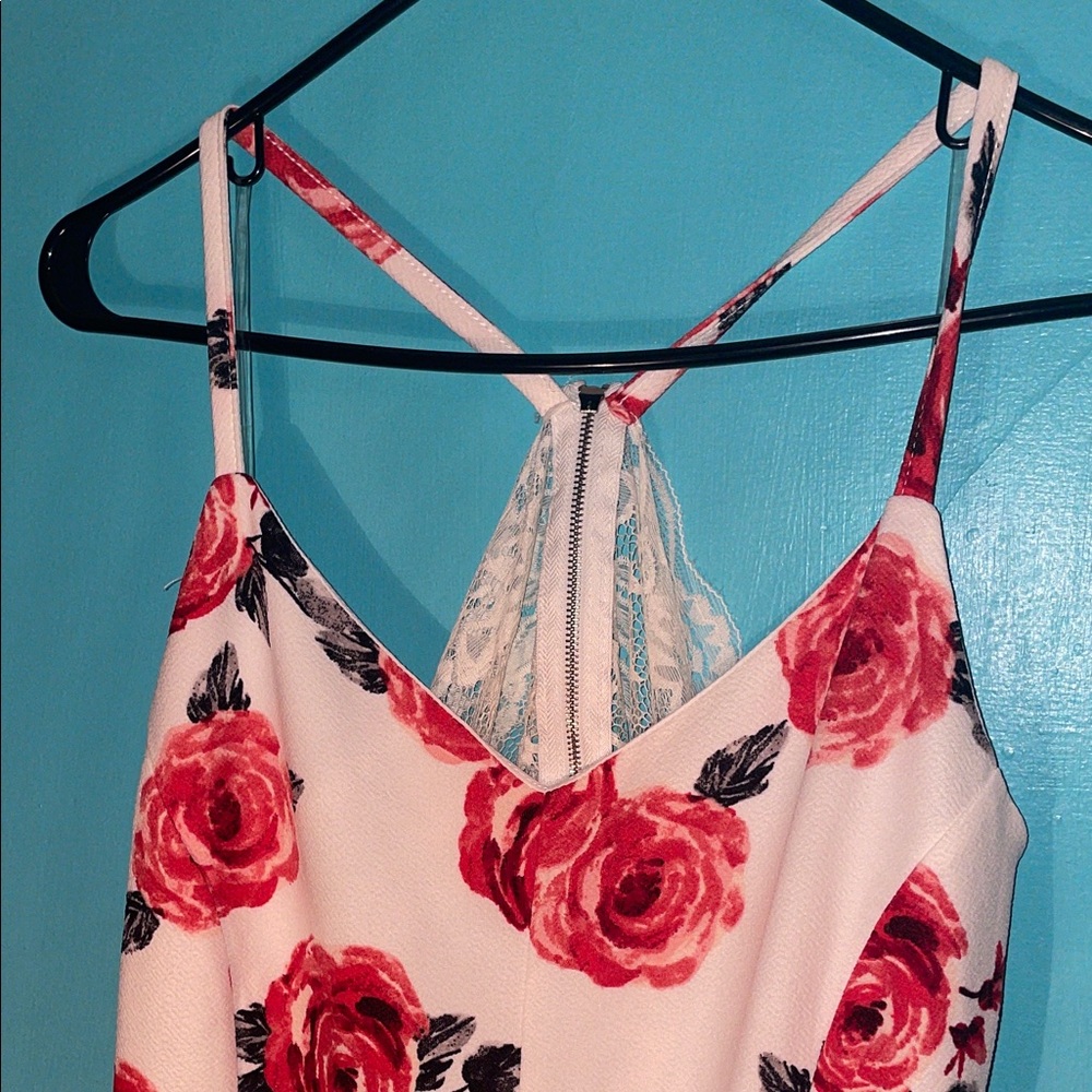 Almost Famous Red and White Floral romper has lace on the back